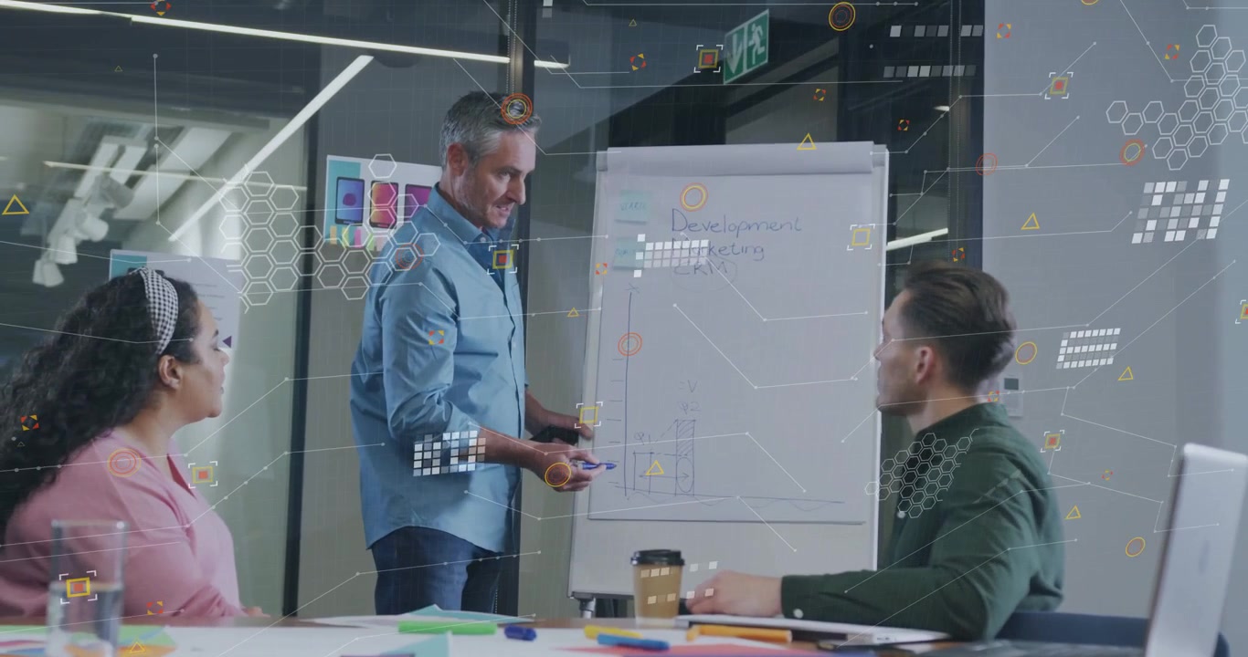 Presenter starting writing Dev Marketing CRM headings on chart adding overlay for business planning