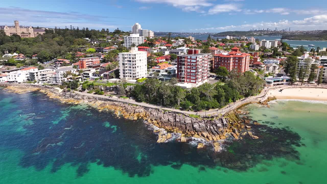 Love Manly Beach With Rocky Shore On Marine Parade, Manly NSW, Australia. Aerial Drone Shot