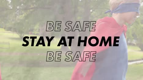 animation of stay at home text over boy and girl playing