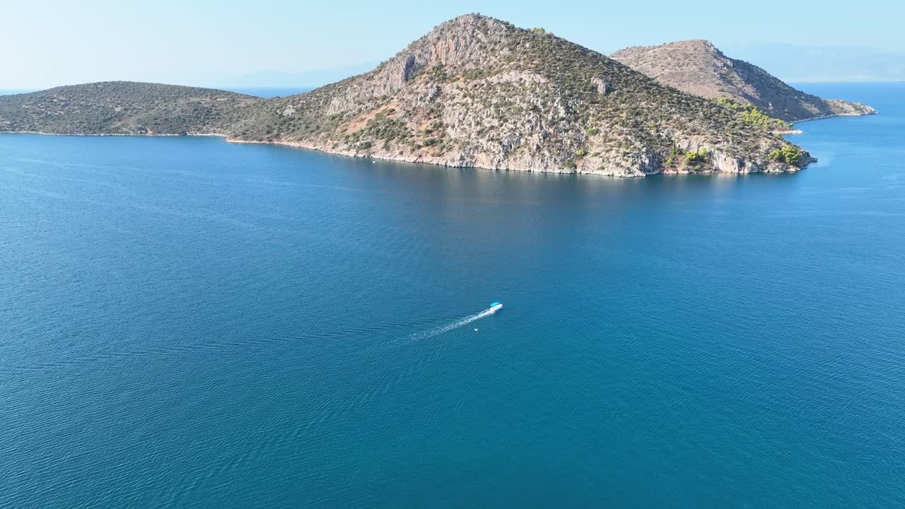 Aerial footage of a small recreational boat in the Aegean sea