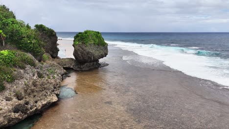 aerial view of magpopongko rock pools and flats, siargao islands, philippines, showing limestone formations, crystal pools, and exposed coral flats along the pacific coast of mindanao during low tide