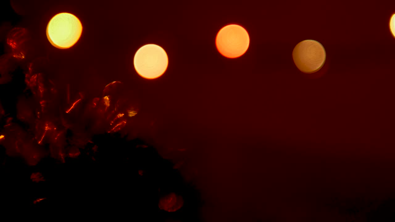 Abstract circles on a black background, bokeh flickers,New Years decorations,festive christmas lights
