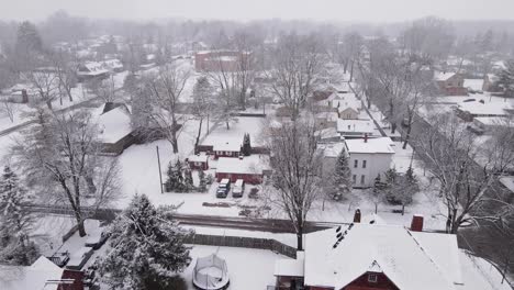 White-rooftops-of-residential-buildings-in-small-town-of-Michigan,-aerial-view