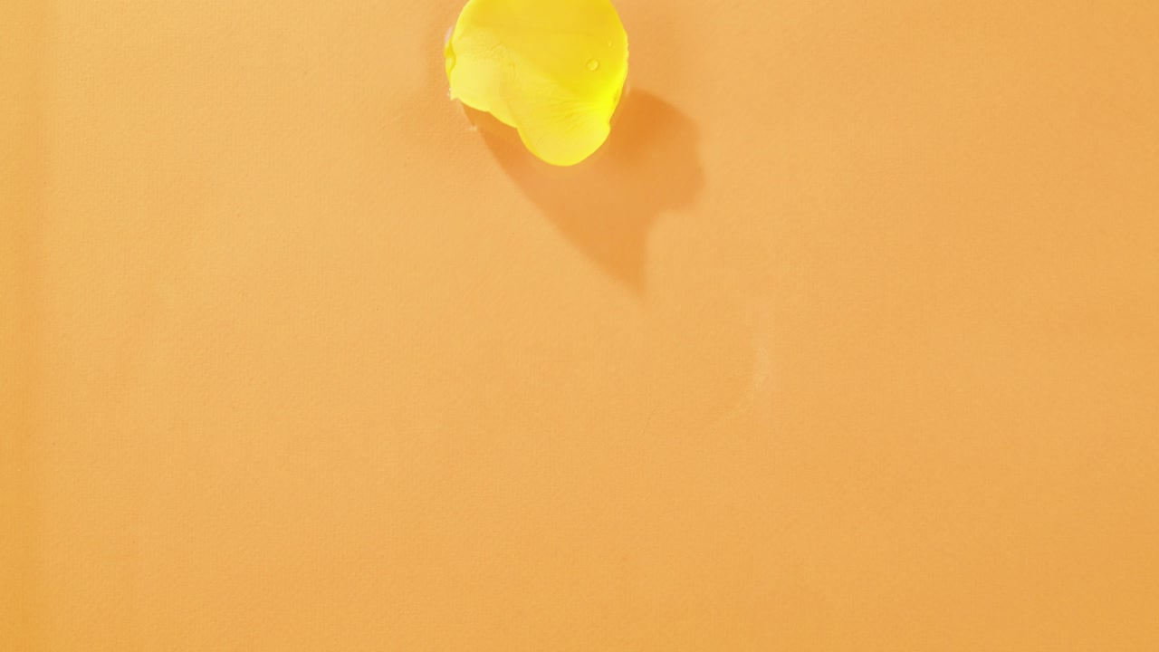 Yellow Object on Orange Background