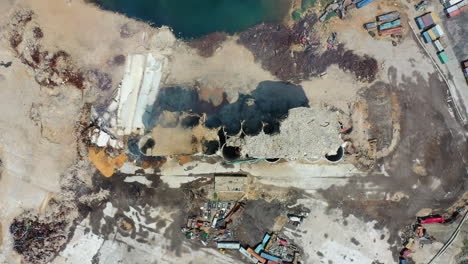 ascending aerial view of the devastation left by the port of beirut explosion