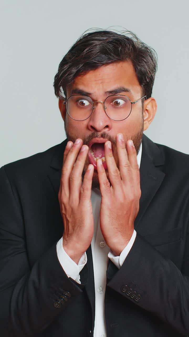 Scared fearful depressed businessman suffering phobia anxiety disorder expresses fear stress panic