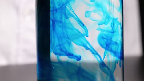 blue dye disperses in water through shaving cream