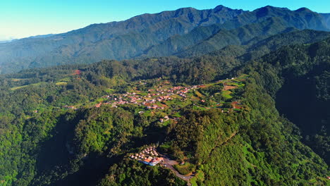 village in the little valley on the top of the picturesque mountain. jaw-dropping scenery of the rocks at the madeira islands, portugal. top view.