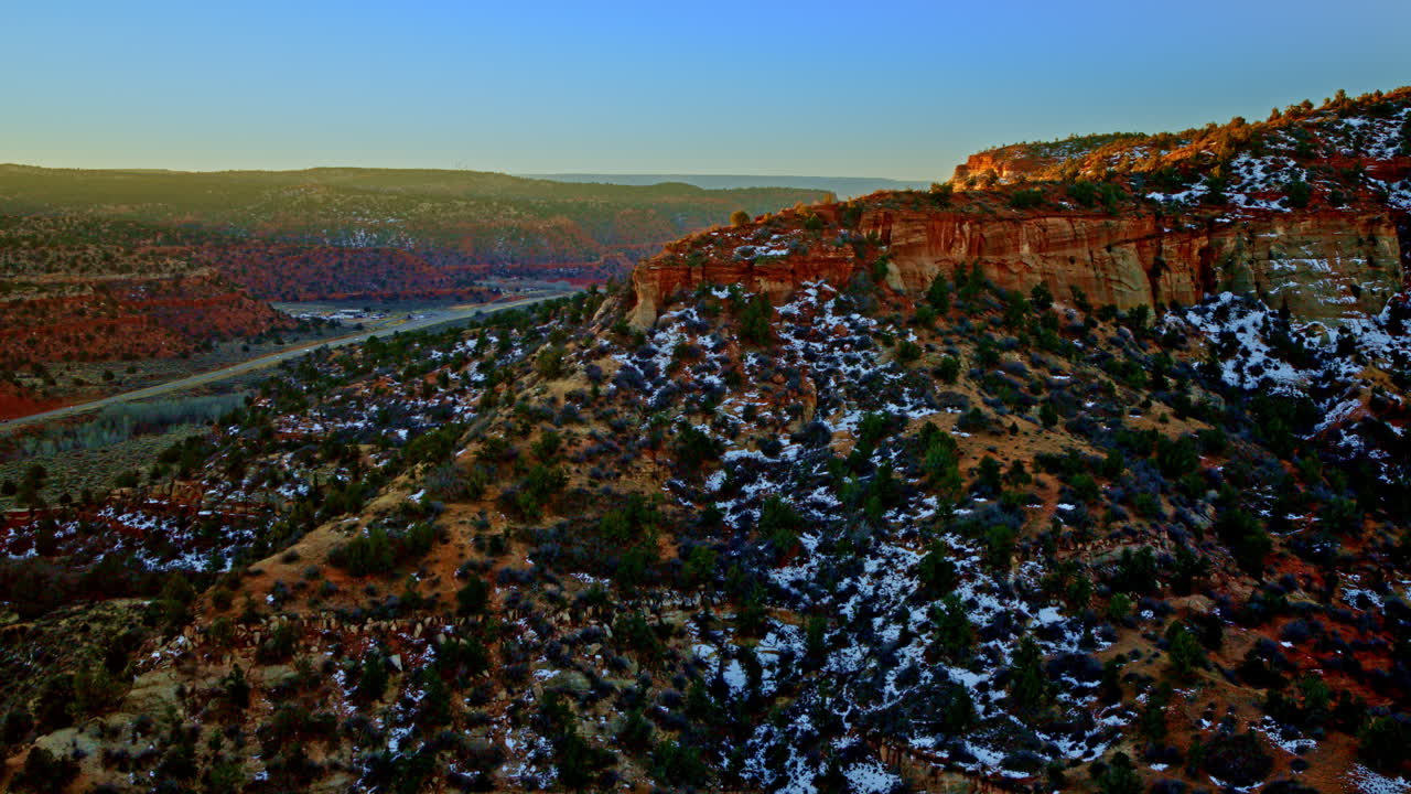 Epic overhead view of unique hoodoo formations in a vividly colored desert scene.
