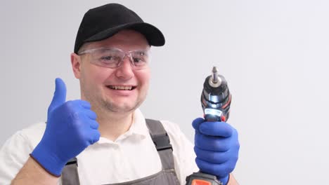 portrait of a man in special construction clothes showing a thumb on a white background portrait of a man in special construction clothes showing a thumb on a white background professional builder place for advertising