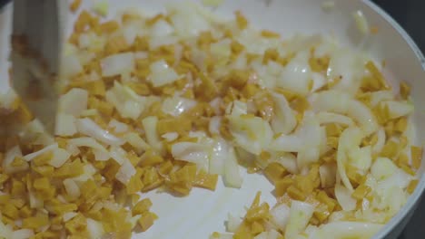 Slow-Motion-Mixing-Onions-and-Carrots-in-Pan-in-120fps