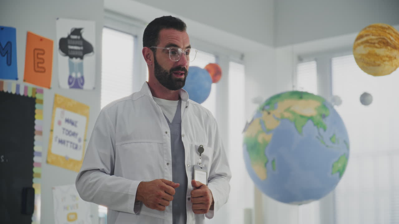 Male Healthcare Professional Explaining Dental Care Rules to Curious Young Students