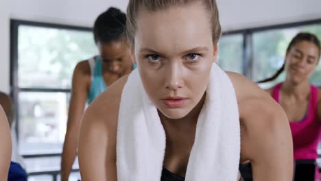 working out on exercise bikes at a gym