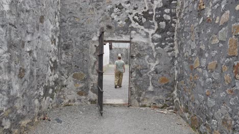 A-Person-Is-Walking-Inside-The-Con-Dao-Prison-In-Ba-Ria-Vung-Tau,-Vietnam