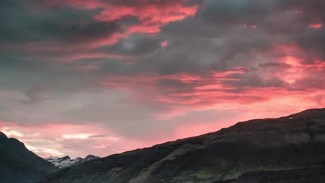 timelapse of clouds passing by midnight sun in south iceland