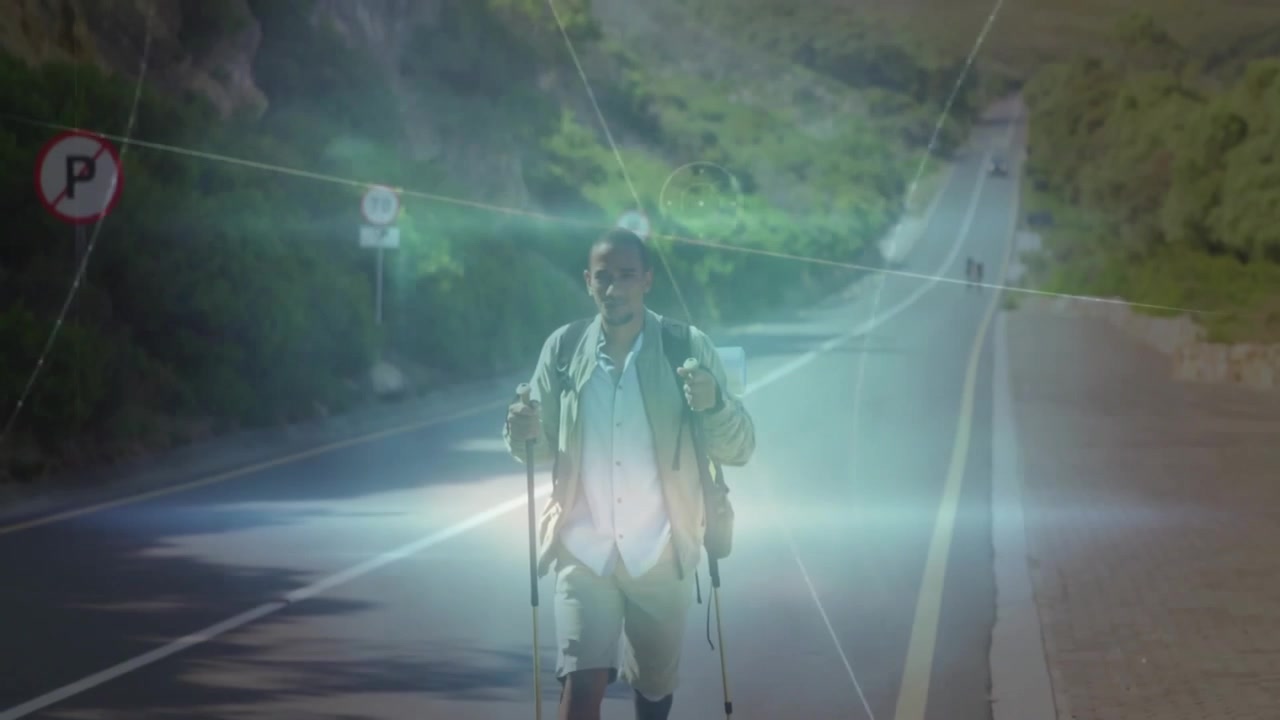 Man hiking on road with digital data processing animation overlay