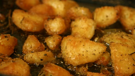 delicious golden roast potatoes in hot oil