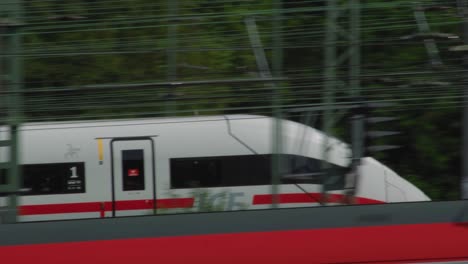 german ice passenger train passing by tracked by camera closeup