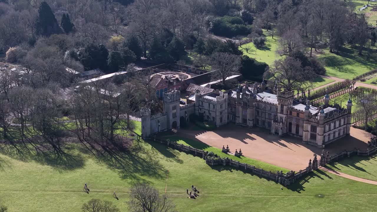 Knebworth house in the uk, showing its grand architecture and expansive grounds, aerial view