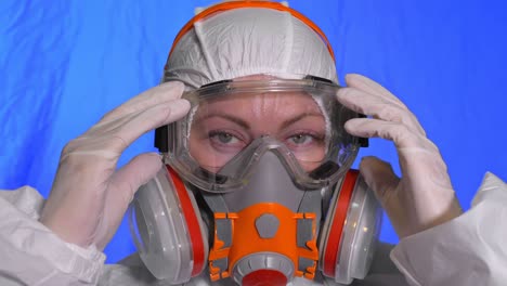 scientist virologist in respirator. woman close up look, wearing protective medical mask. concept health safety n1h1 coronavirus epidemic 2019 ncov.