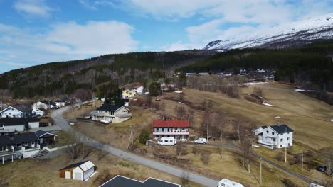 aerial dolly shot of a rural hillside neighborhood in gratangen, norway during daytime