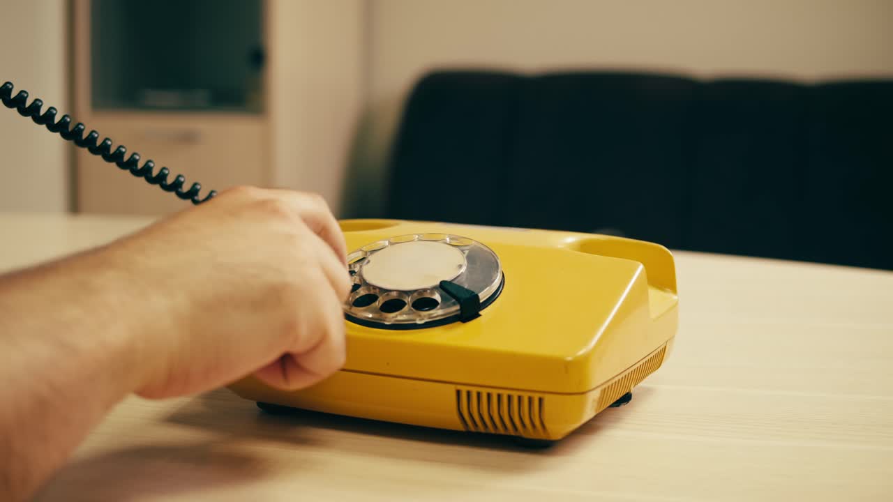 Retro vintage phone, A yellow rotary telephone is displayed on a wooden desk, adding a nostalgic touch