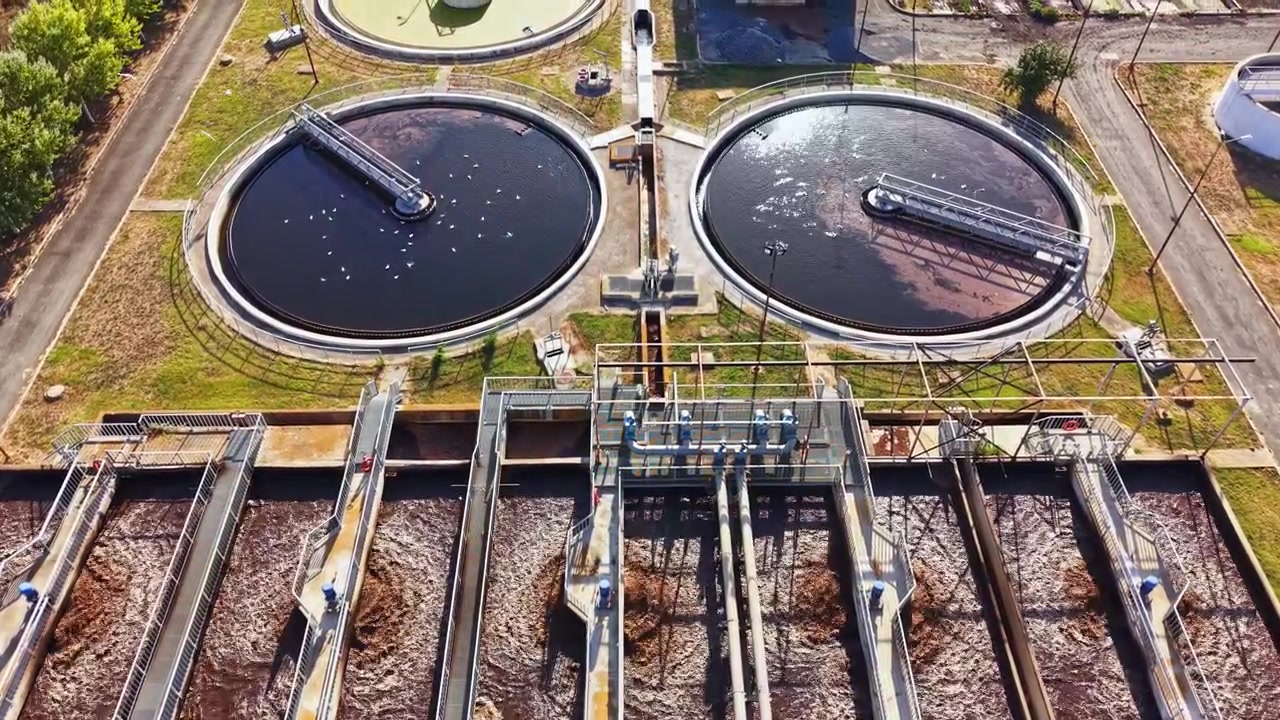 Water treatment facility processing wastewater in a large plant during daylight hours
