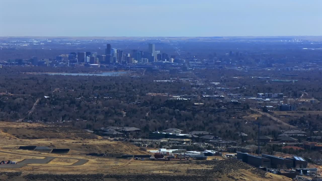 Lookout Mountain Golden Downtown Denver cityscape from North Table Mesa aerial drone Colorado daytime winter sunny clouds neighborhood Front Range Rocky Mountains Arvada Lakewood parallax right motion