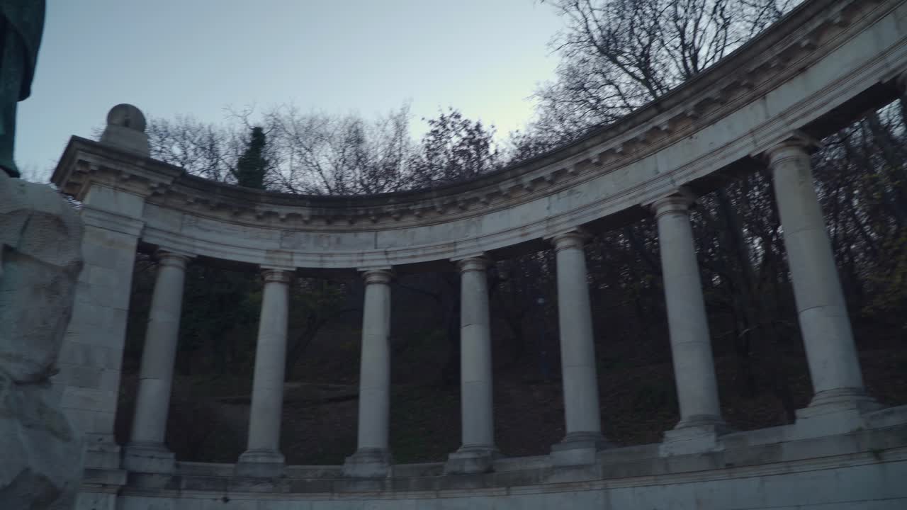 Structure with Curved Columns In Intricate Ancient Details In Budapest Hungary - tilted up wide shot
