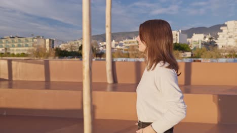 Medium-truck-shot-of-a-woman-walking-on-a-pier-during-golden-hour