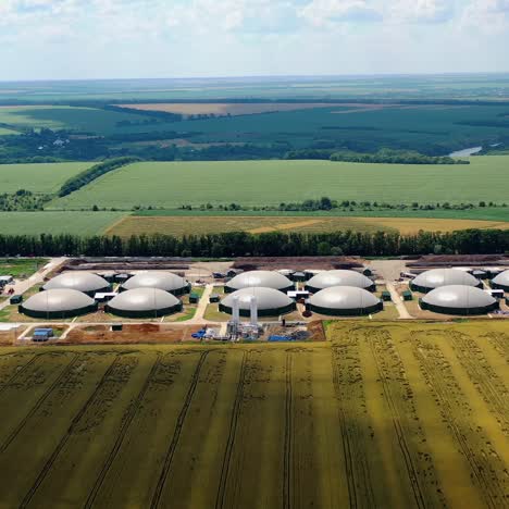large gas storage on the field. factory and power plant with many storage tanks