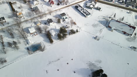 drone shot of percé village during winter