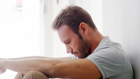 sad man sitting on the floor