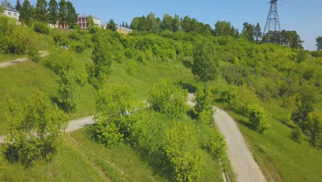 just-married-couple-on-hairpin-curves-on-hill-bird-eye-view