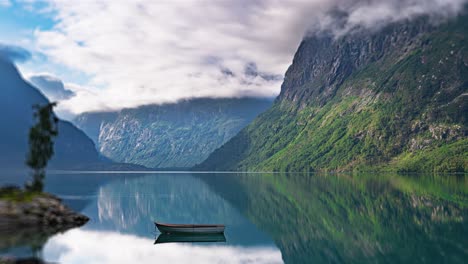 a tranquil timelapse video of mirrorlike waters of the loen lake and forest-covered mountains