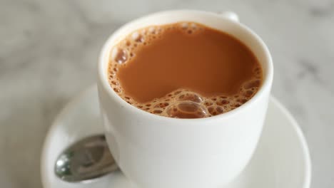 close up of cup of milk tea on table ,