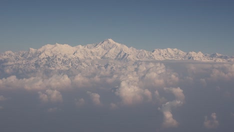 Scenic-aerial-flight-over-the-worlds-largest-mountains,-the-Himalayas-with-views-of-Mount-Everest-and-jagged-snowcapped-peaks