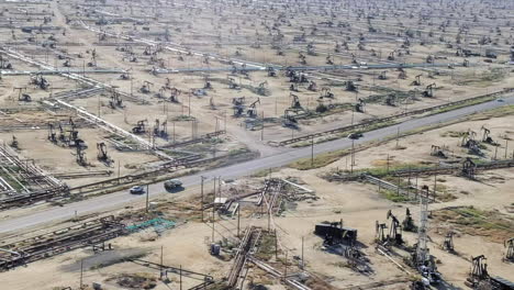 Pipelines-And-Oil-Wells-Near-Missouri-Triangle-In-California,-USA---aerial-shot