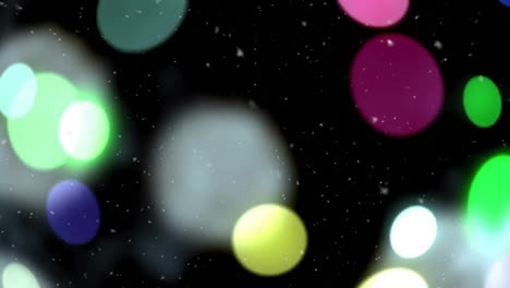 Glowing-bokeh-lights-and-falling-snowflakes-animation-on-dark-background