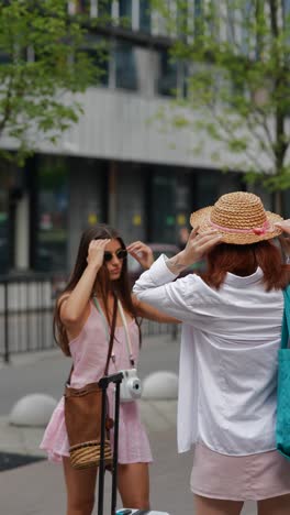 two women friends on city street