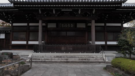 walking to the main building of a beautiful temple in the nerimasu neighborhood of tokyo, japan