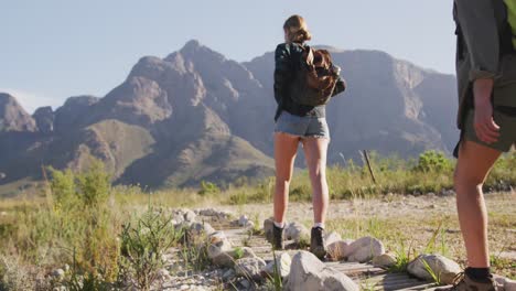 caucasian couple hiking in nature