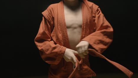 Young boy tying his sambo belt