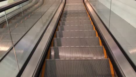 Escalator-POV-of-person-riding-on-one