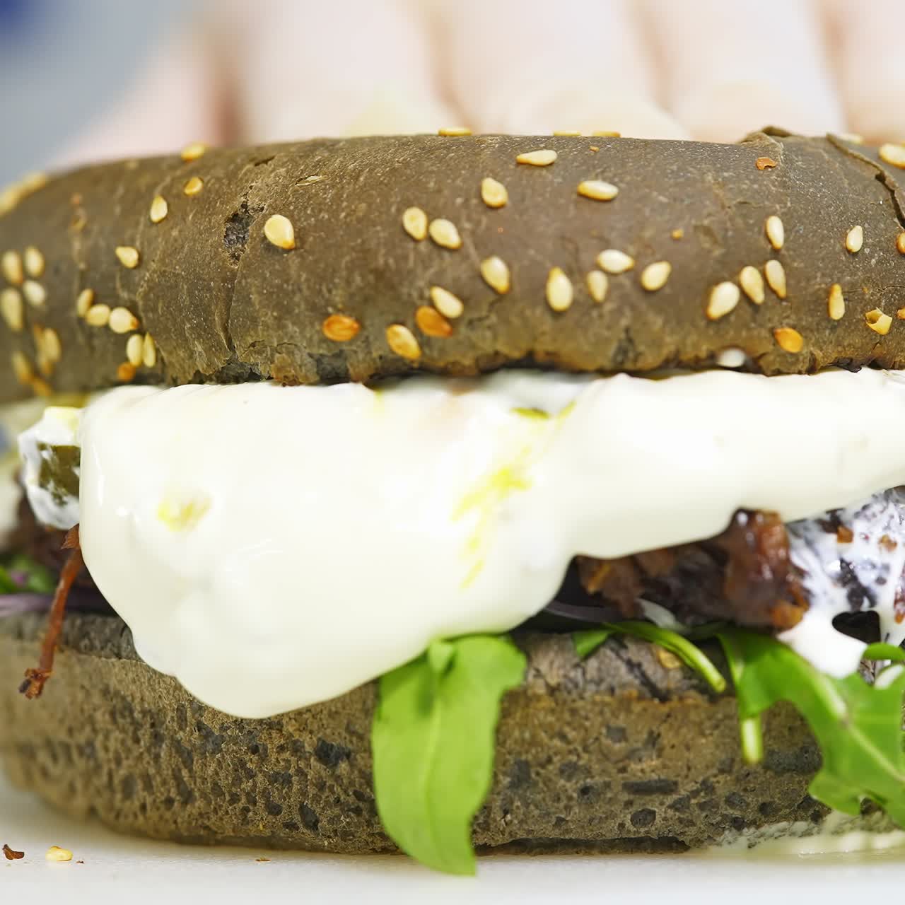 Hamburger, burger, cheeseburger. Juicy, tasty, freshly prepared. Fatty burger with fries and sauce, on a white tray. Fast food, junk food