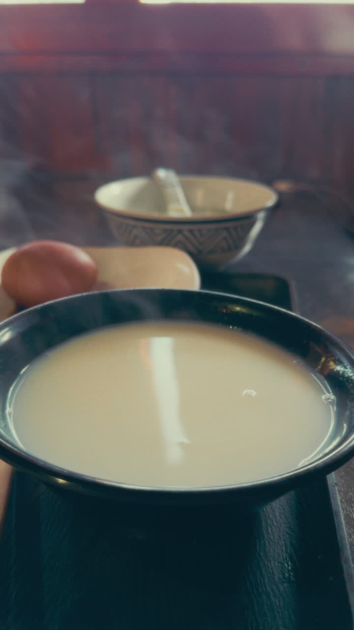 Person eating Japanese Rice Porridge