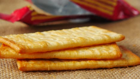 stack of crackers on burlap