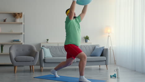 man doing a workout at home with a stability ball