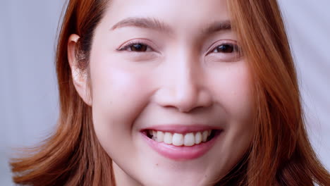 young asian woman in close up face portrait smile happy