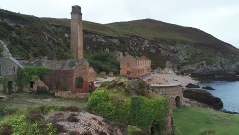 porth wen aerial flyover view abandoned victorian industrial brickwork factory remains on anglesey eroded coastline